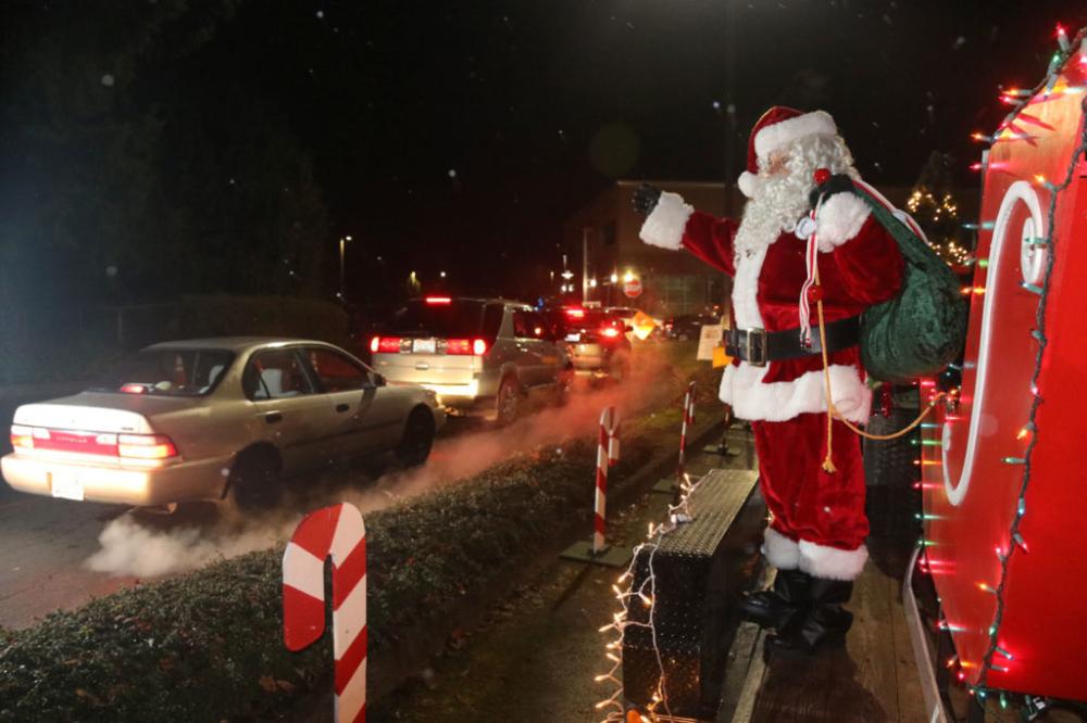 Santa waves to onlookers at the Parade of Lights.